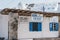 Rooms and apartments for rent sign on a house in Hora Mykonos Town, Greece