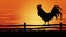 A rooster standing on a fence at sunset