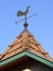 Rooster weather vane on the roof
