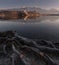 The Roots Of Lake Bled, Slovenia. Winter Landscape Of Famous Place With Beautiful Foreground, Small Island In The Middle Of The La