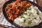 Ropa vieja: beef stew in tomato sauce with vegetables and rice g