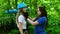 Rope adventure - a woman instructor puts on the insurance helmet on a head of young woman