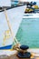 Rope anchor on old marine mooring bollard