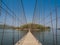 Rope bridge direct to lonely island across the lake