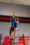 Rope Climb exercise man workout at gym