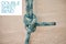 Rope climbing for mountain rock hiking, strong secure safety knot tie and closeup zoom on wood background. Double sheet