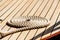 Rope neatly coiled on the wooden deck of a boat