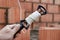 Rope plumb for even brickwork. Compliance with the correct laying of walls and corners of ceramic bricks. Bricklayer\'s tool