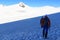 Rope team mountaineering with Crampons on glacier Pasterze and snow mountain panorama towards summit Johannisberg in Glockner