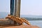 Rope tightened with boat clamp with beautiful view of lake in backgrounds