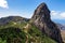 Roque Agando - Scenic mountain road with view on massive volcanic rock formation Roque de Agando on La Gomera, Spain