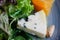 Roquefort cheese cut out with oranges and greens. Appetizer, salads. Healthy food. Restaurand and homemade food.