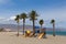 Roquetas de Mar beach wih palm trees Costa Almeria Spain La Romanilla