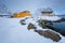 Rorbu house and drying flakes for stockfish cod fish in winter. Lofoten islands, Norway