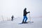 Rosa Khutor, Sochi, Russia, January, 26, 2018. Skiers descend from the ski slopes `Triton` in reduced visibility in heavy fog on s