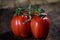 Rosa on tasty Italian tomatoes, wooden table