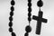 Rosary against white background. Christianity, religion, faith concept
