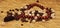Rosary beads, coffee beans, brown food, decor