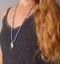 Rosary mala 108 beads from natural stones Aquamarine are worn on a girl in a grey shirt. Author`s jewelry from natural stones,