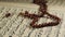 Rosary on the Quran Page