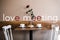 Rose, coffee and dessert on a wooden table. table with two white chairs on a light background side view. cozy place for a date
