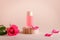 Rose extract facial serum in refillable bottle with rose flower and petals