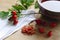 Rose hips and rose hip tea in a pottery cup, strengthening the i