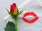 A rose and a lipstick kiss
