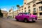 Rose old american classical car in road of old Havana Cuba