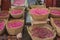 Rose petals in baskets at the souk, Moroccan market in the medina, Fes, Morocco