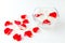 Rose petals in a bowl with water on a white background. SPA concept, cosmetics, procedure, treatment.