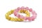 Rose quartz bracelet and golden rutilated quartz bracelet crystal gemstone on white background.