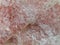 Rose quartz texture background, close up of pink gemstone surface