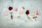 Rose, red, and white wine glasses, with corkscrews and corks, overhead flat lay