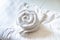 Rose Shape Towel decoration on the Clean White Bed