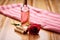 a rose wine bottle lying horizontally on bamboo mat