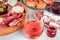 Rose wine with charcuterie, cheese, and salmon sandwiches. Spanish tapas