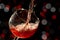 Rose wine falling in a way splashing into a wine glass