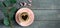 Rosemary branch and coffee with a heart on a wooden background. Concept of holiday, birthday, Easter, valentines day