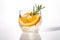 Rosemary Citrus Spritzer with a slice of orange and a sprig of rosemary. AI generative image.