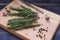 Rosemary plant on wooden rustic table from above, fresh organic herbs