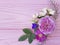 Roses beautiful bouquet design season frame on a pink wooden background jasmine, magnolia