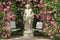 Roses and gods statue in the rose garden Beutig in Baden-Baden