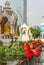 Roses lay in a fountain at a Buddhist shrine in Bangkok