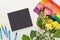 Roses on a rainbow flag and chalkboard with chalks