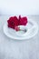 Roses on the white china dishes