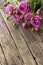 Roses on a wooden grungy background