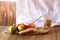 Rosh hashanah (jewesh holiday) concept - shofar, torah book, honey, apple and pomegranate over wooden table. traditional holiday