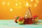 Rosh hashanah jewish new year holiday celebration concept. Honey and apples over yellow background