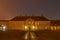 Roskilde Palace, a yellow mansion at night